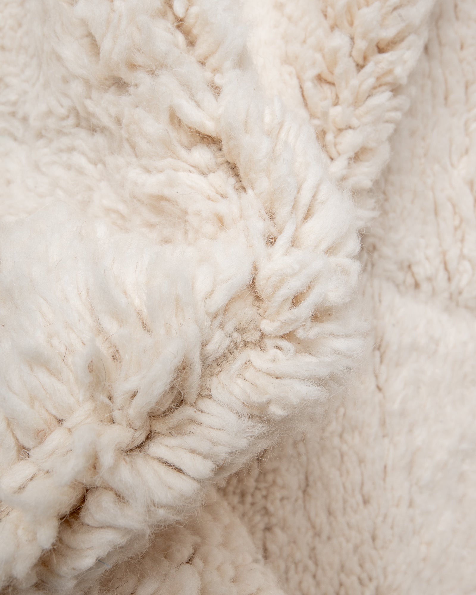 Modern, designer, handcrafted Berber rug from Morocco. Beniourain carpet with minimalist design, natural wool pile and a fluffy texture.